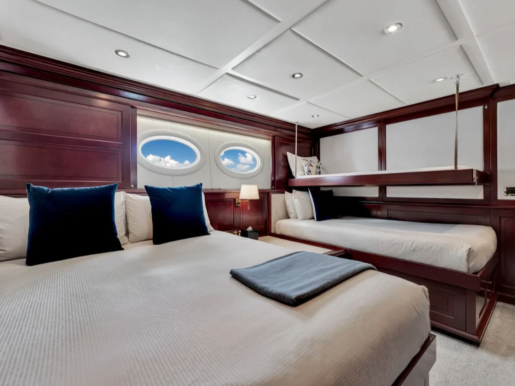 A twin cabin on the 166 Trinity yacht with two beds