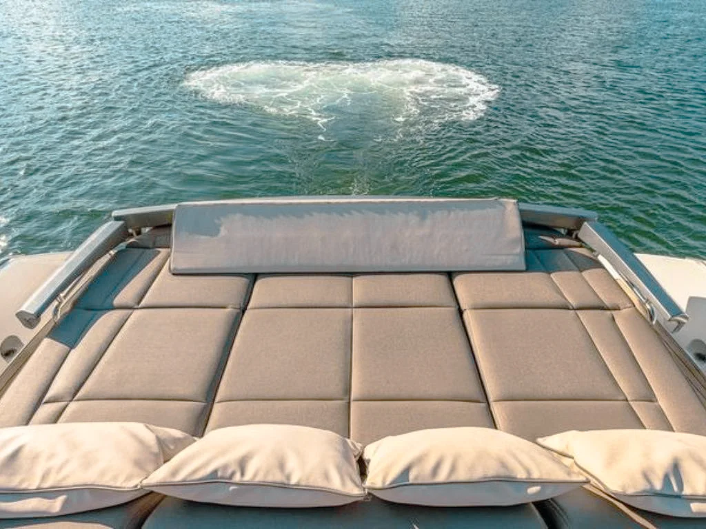 Deck lounge area on the 70 Pershing yacht with comfortable seating