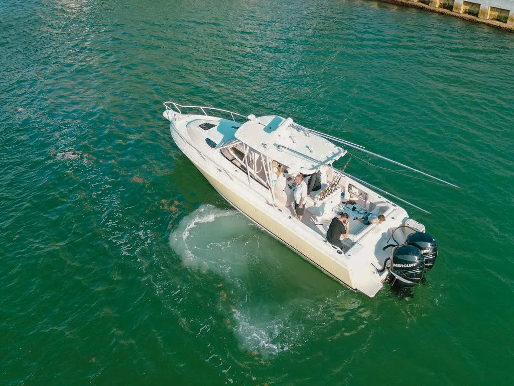 35 Intrepid yacht cruising towards a sunset in Miami