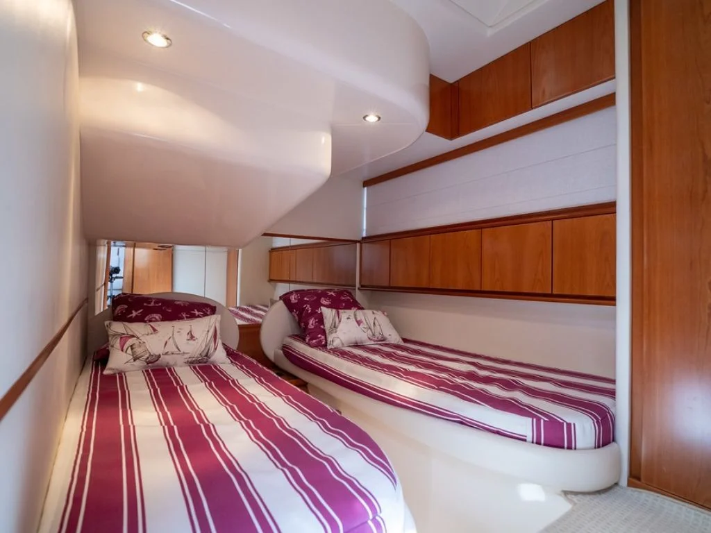 Luxurious master cabin with a double bed on the 50 Pershing