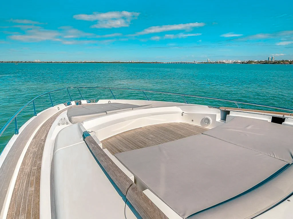 Yacht deck with outdoor seating area and ocean view