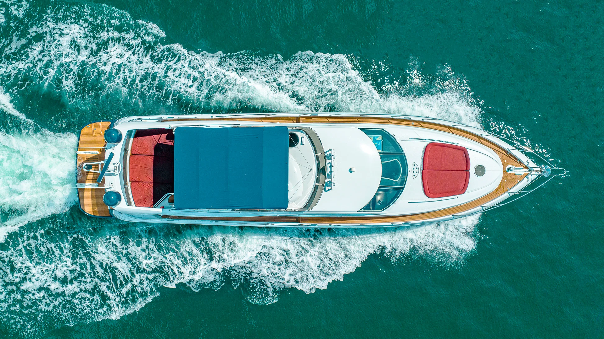 Luxurious 80ft Sunseeker yacht docked in Miami with sparkling city skyline view