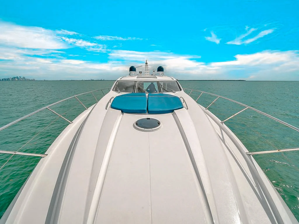 Outdoor dining area on the deck of the 72 Sunseeker II yacht with ocean views