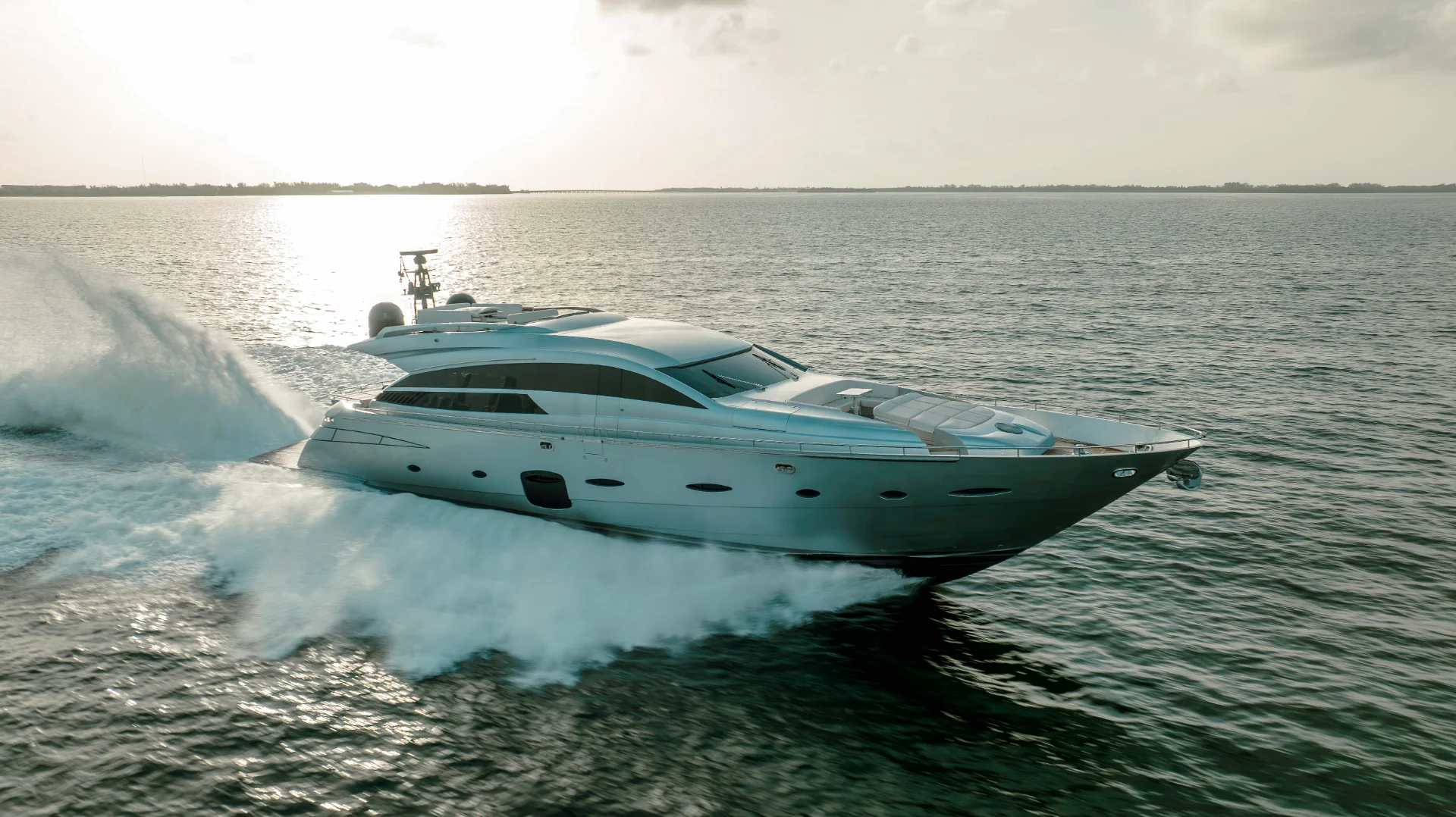 Iconic 92ft Pershing yacht cruising Miami waters for private charter rental.