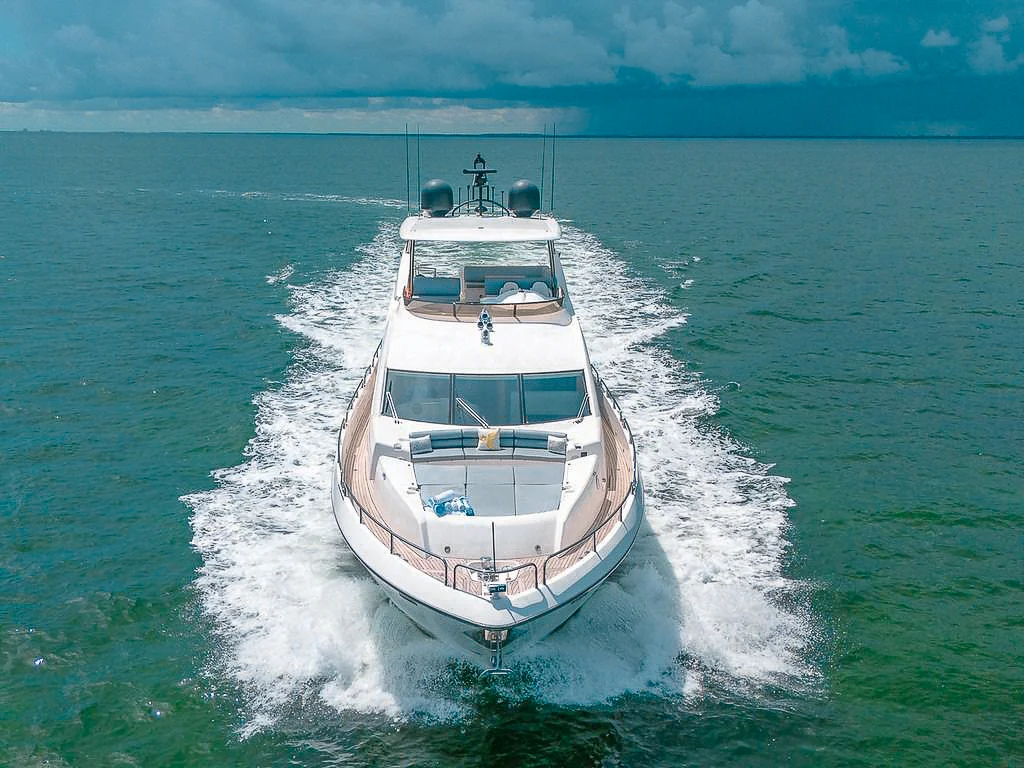 Luxury 80ft Sunseeker II yacht cruising the clear waters of Miami on a sunny day.
