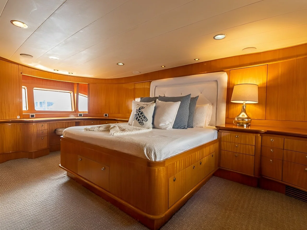 Inside view of a comfortable yacht cabin with bed