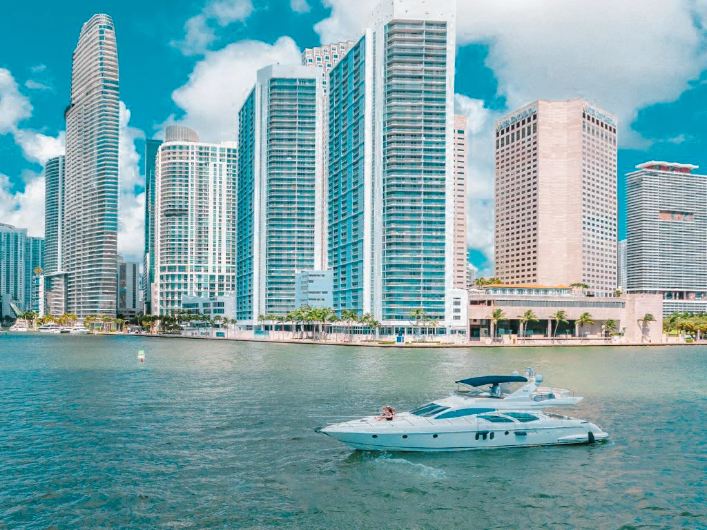 The luxurious Sirena 88 yacht moored in a beautiful marina, perfect for charter.