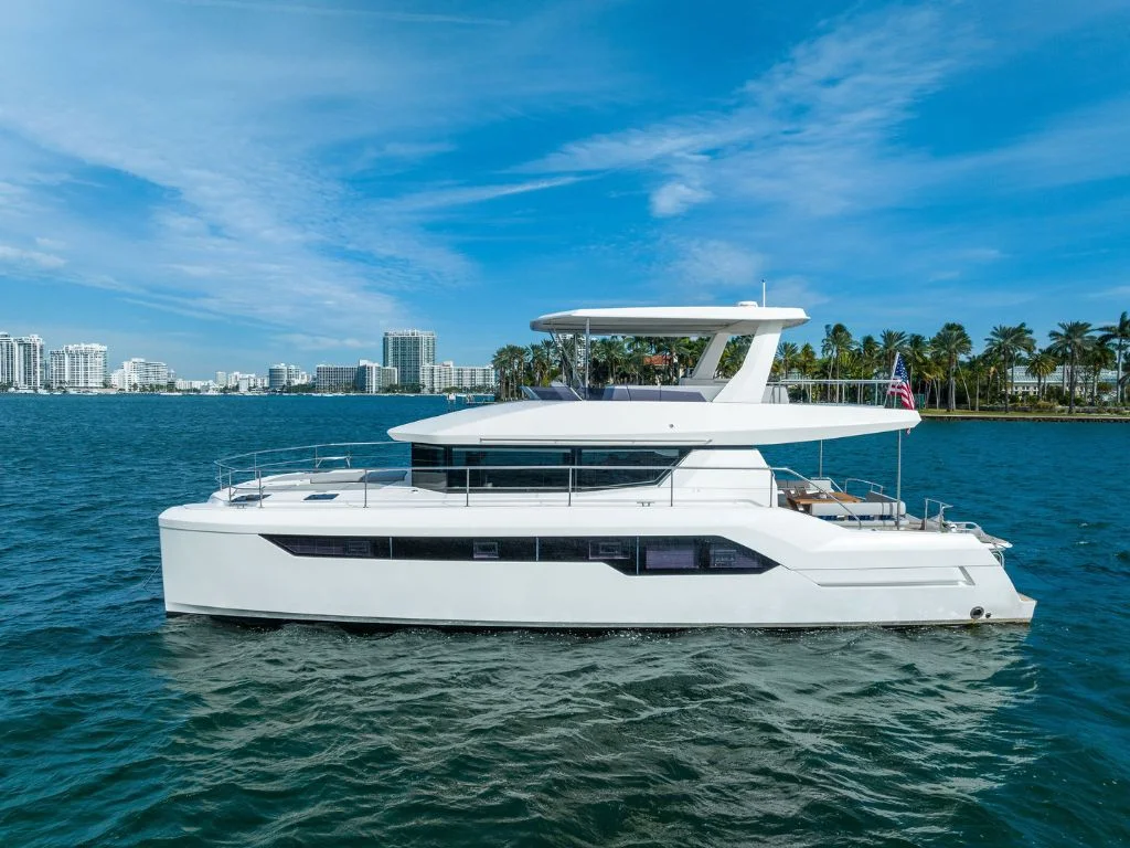 Luxurious 60ft Leopard yacht docked in Miami ready for private charter adventures on the clear blue waters.