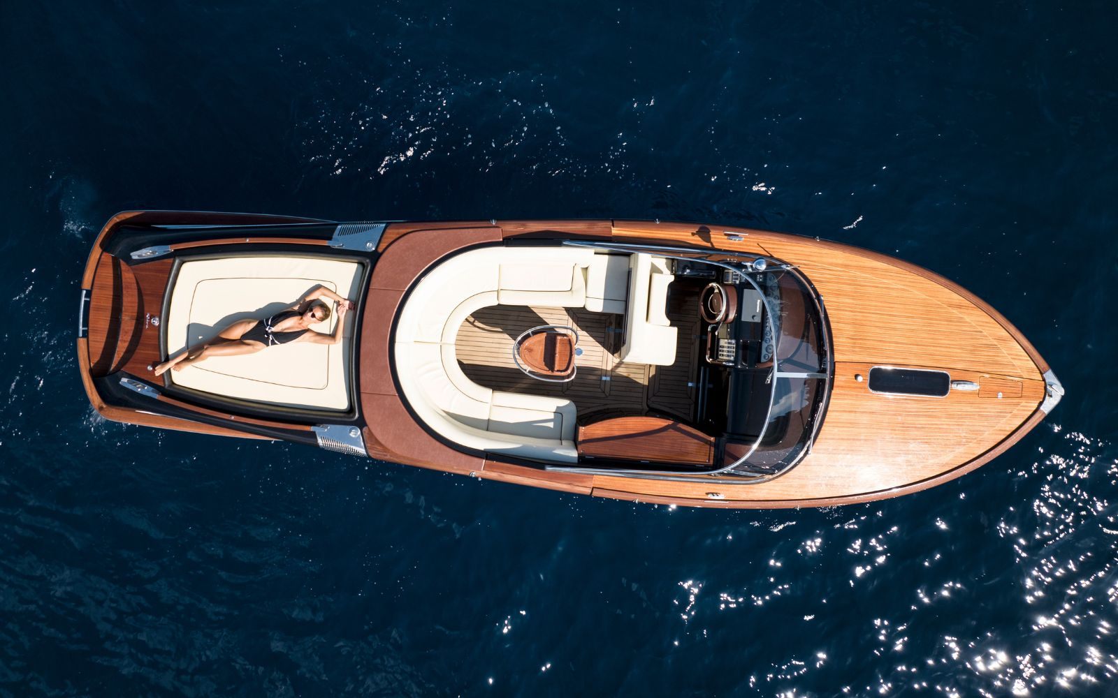 A happy couple enjoying the bow of the 33 Riva Aquariva Super yacht