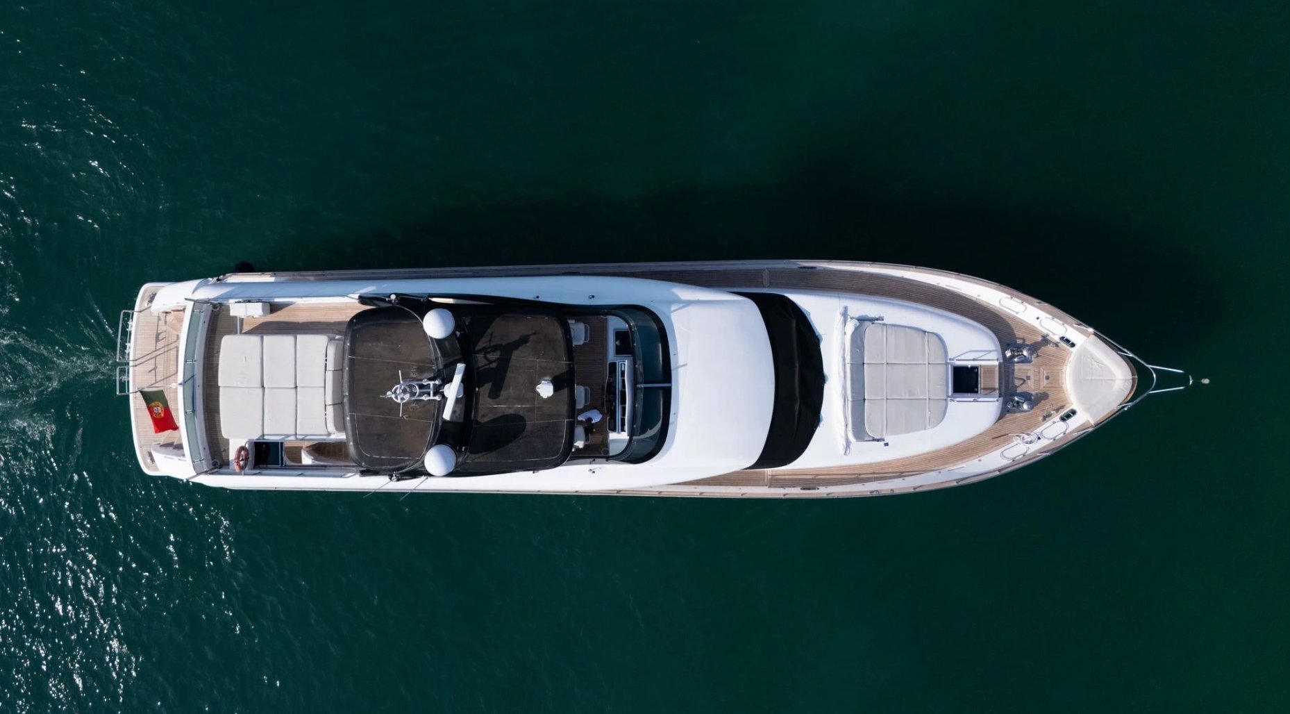 Deck lounge area on the 90 Maiora yacht with seating