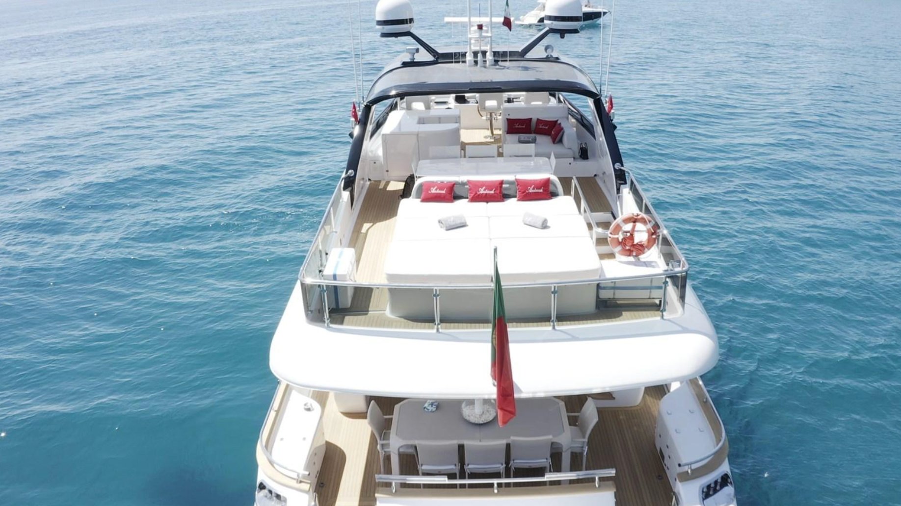Master cabin of the 90 Maiora yacht with a large bed and window