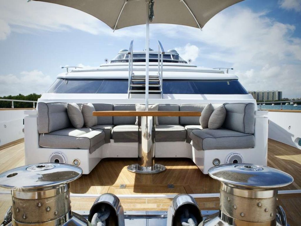 The main deck dining area of the 108 San Lorenzo yacht with comfortable seating