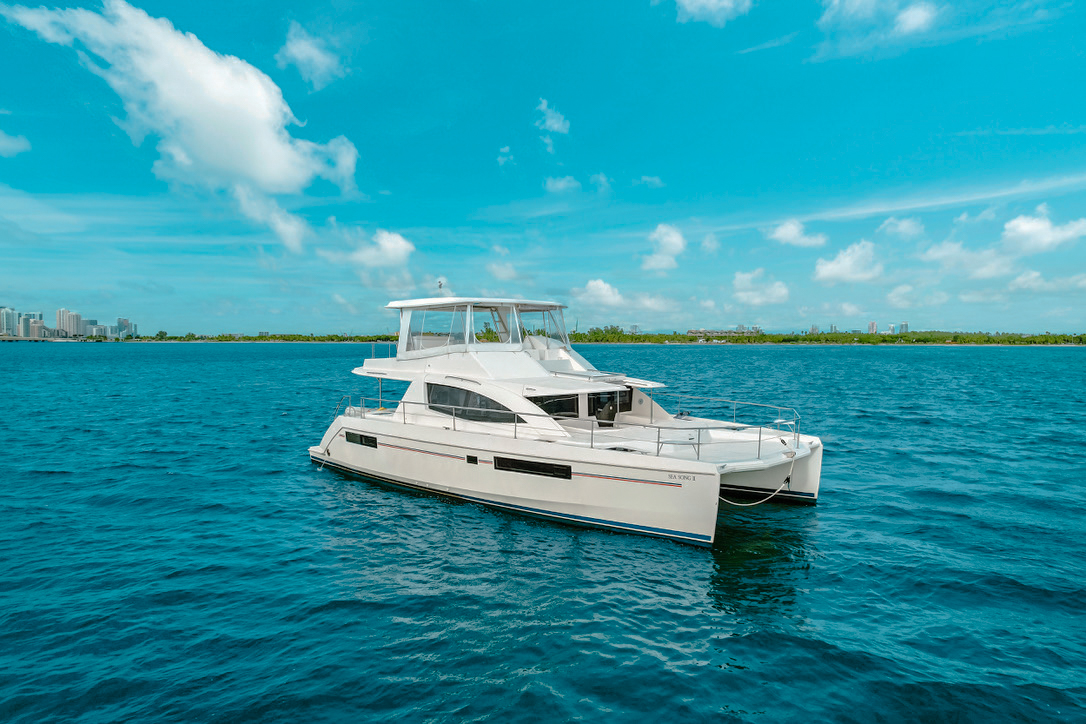 Luxury 52ft Leopard yacht sailing in Miami's clear blue waters for a private charter.