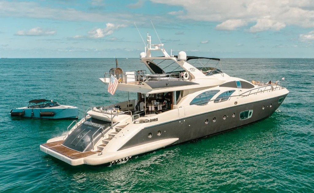 Exterior view of the 100 Azimut yacht cruising on calm Miami waters
