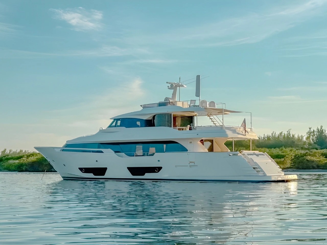 Exterior view of the 94 Custom Line yacht cruising in Miami