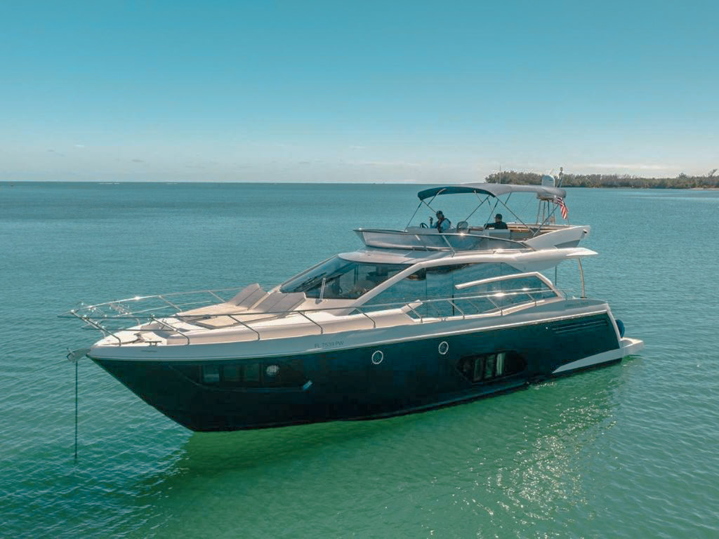 Exterior view of 55 Absolute luxury yacht in Miami with blue waters