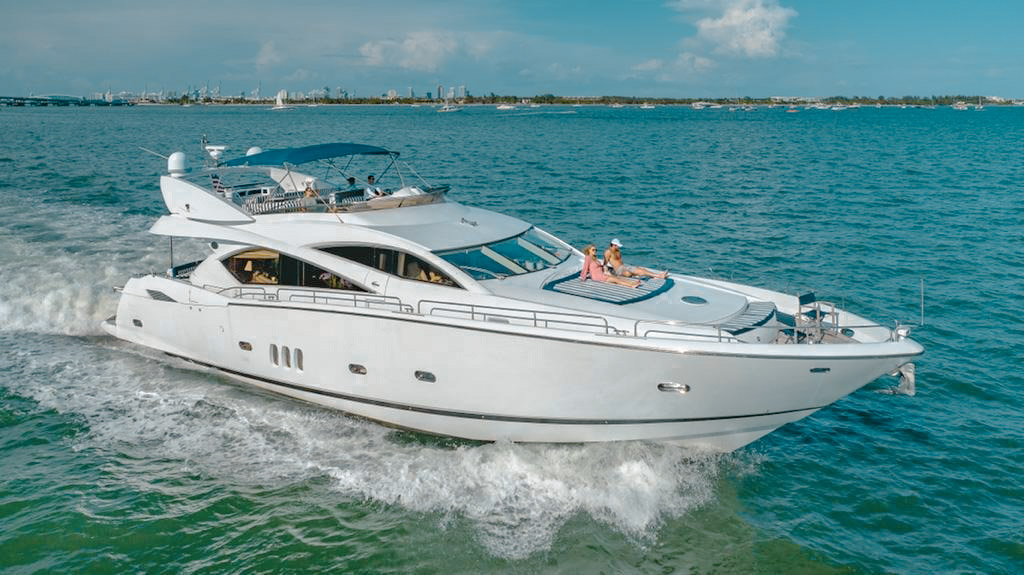 Yacht charter in mild choppy water with a captain steering, symbolizing weather preparedness