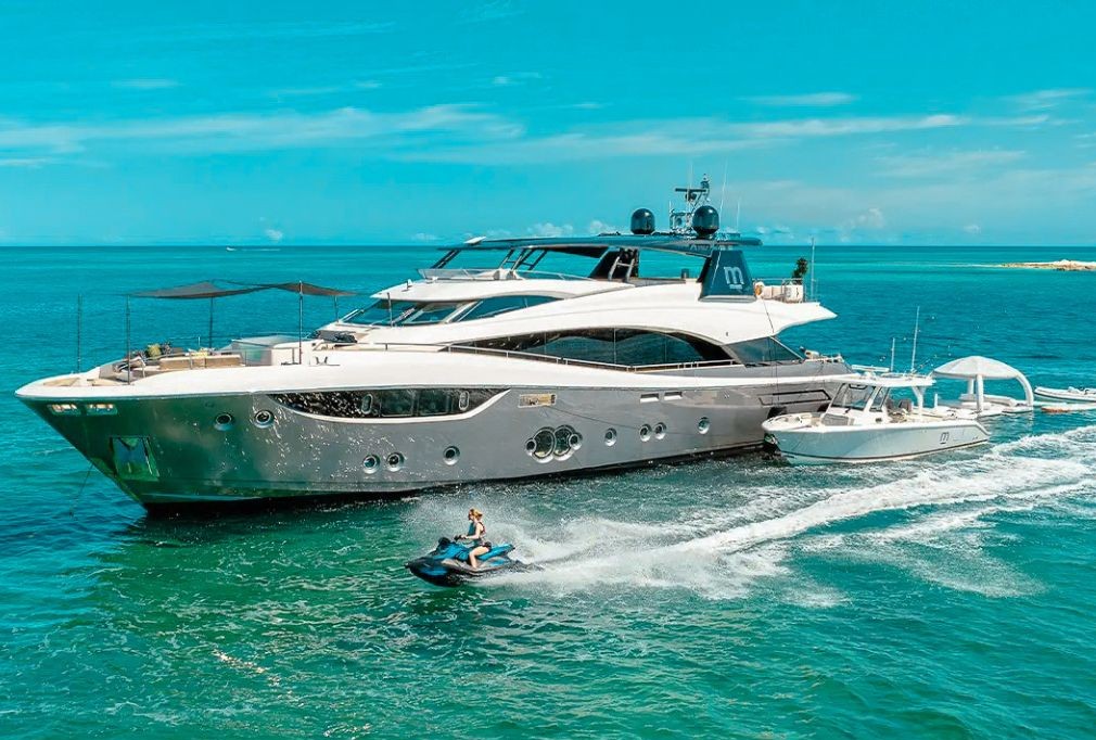 Side view of the 105 Monte Carlo yacht cruising in The Bahamas