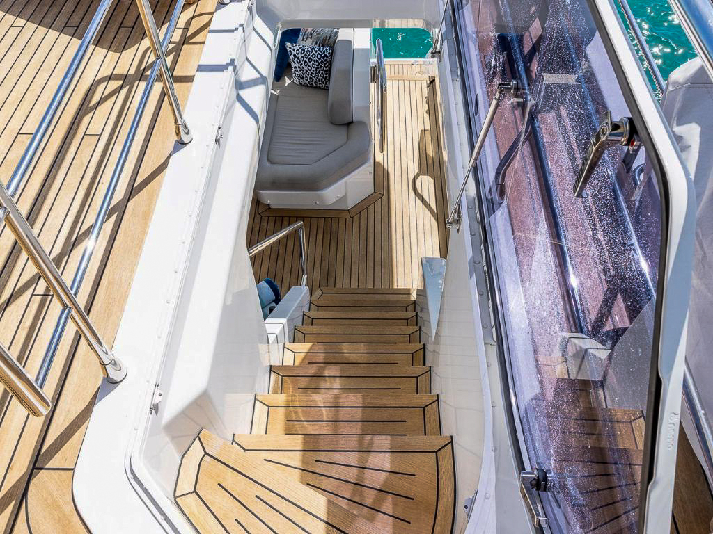 Spacious flybridge of the 88 Azimut yacht with lounge chairs