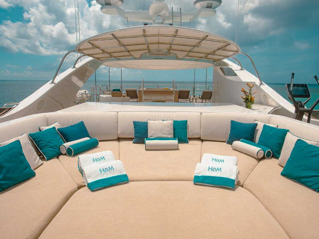 Guests relaxing on the spacious sundeck of the 143 Benetti yacht