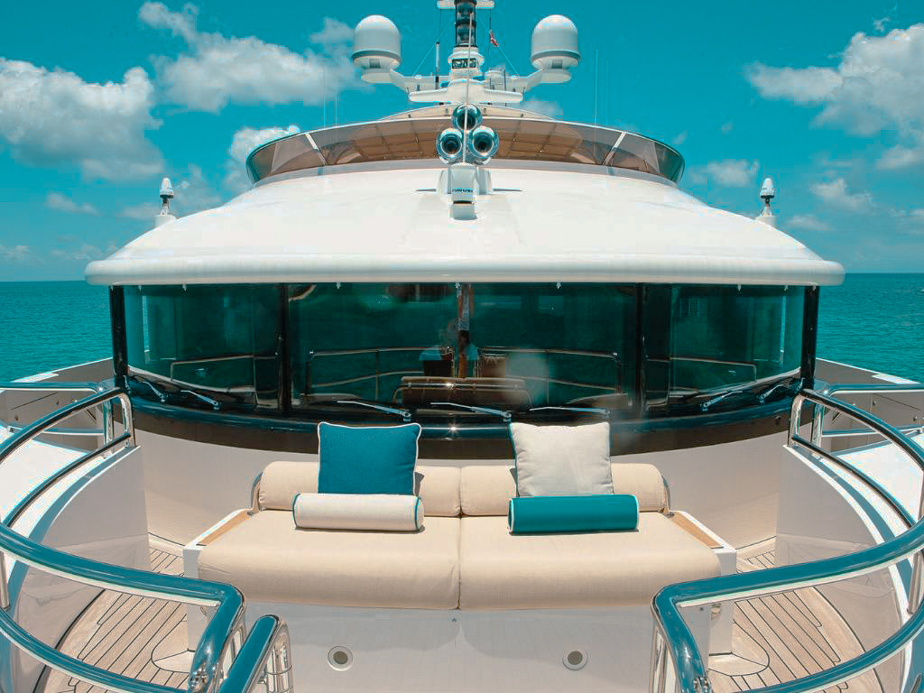 Side view of the 143 Benetti yacht docked in a marina