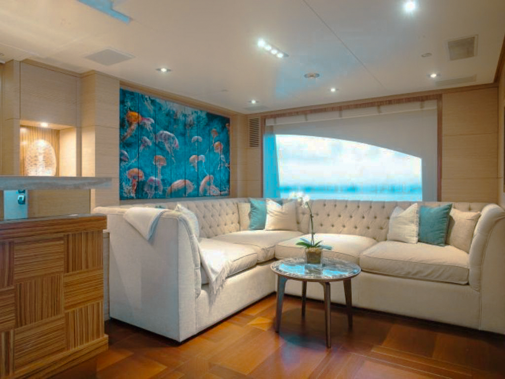 A yacht tender with guests approaching a pristine beach in the Bahamas