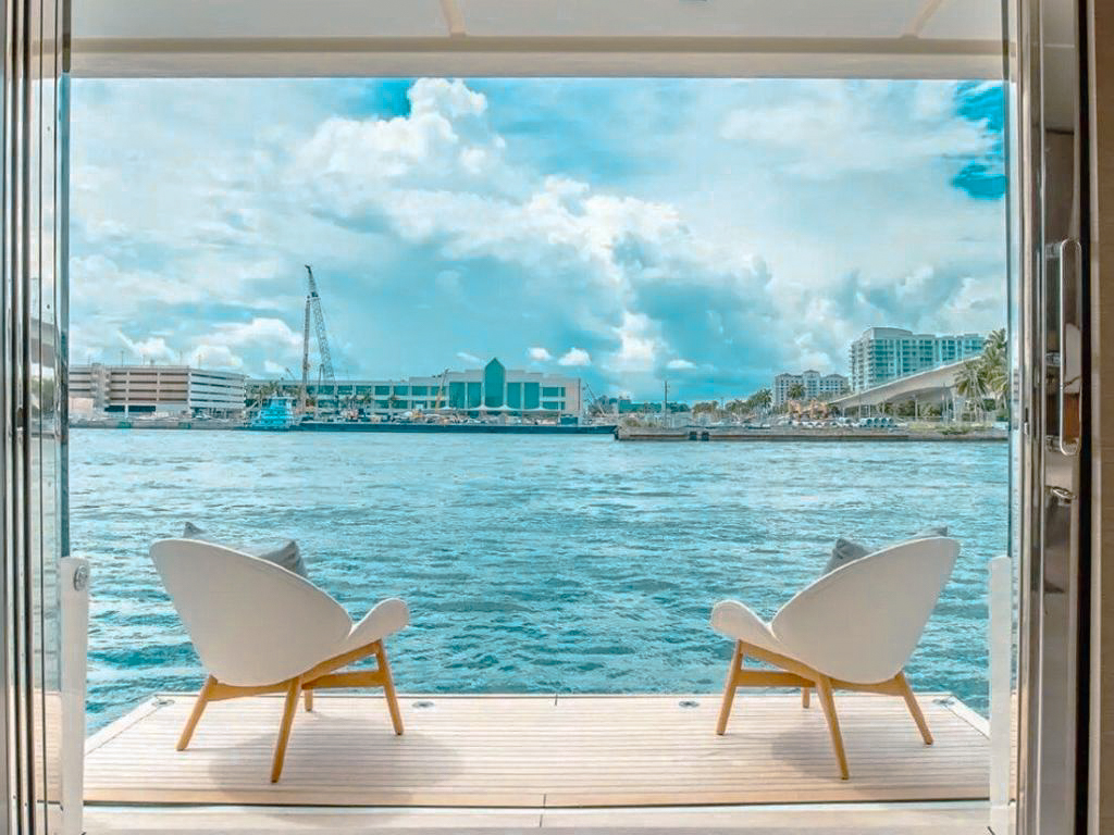 A luxurious and spacious exterior lounge area on the 108 Ferretti yacht