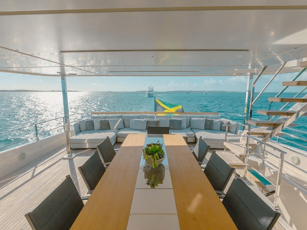 An impressive view of the 108 Ferretti superyacht at sunset in The Bahamas