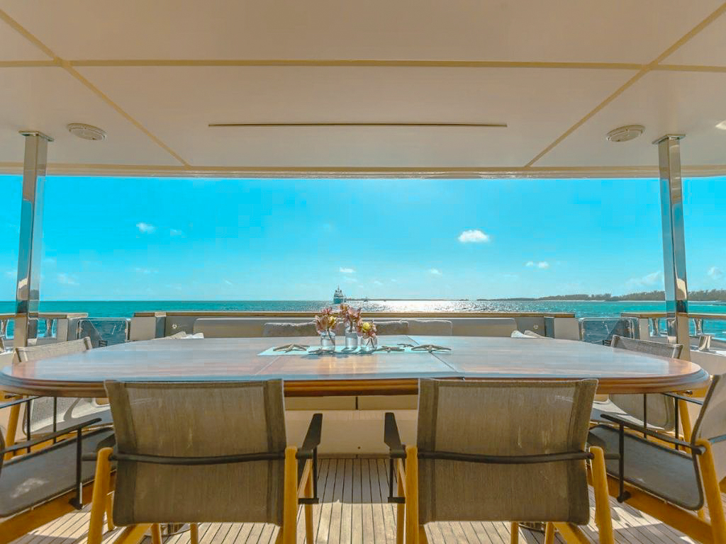 Guests enjoying the swimming pool and sun deck on the 108 Ferretti yacht