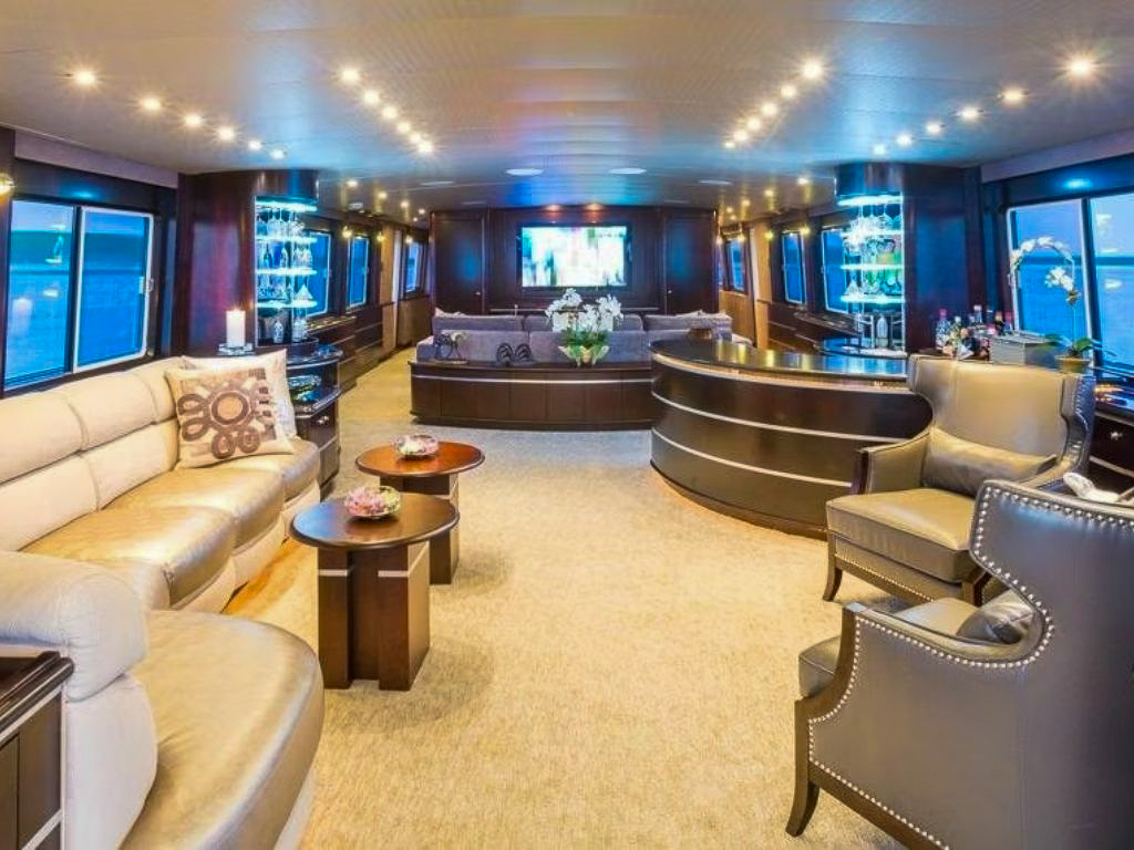 View of the 116 Crescent yacht cruising in clear blue waters