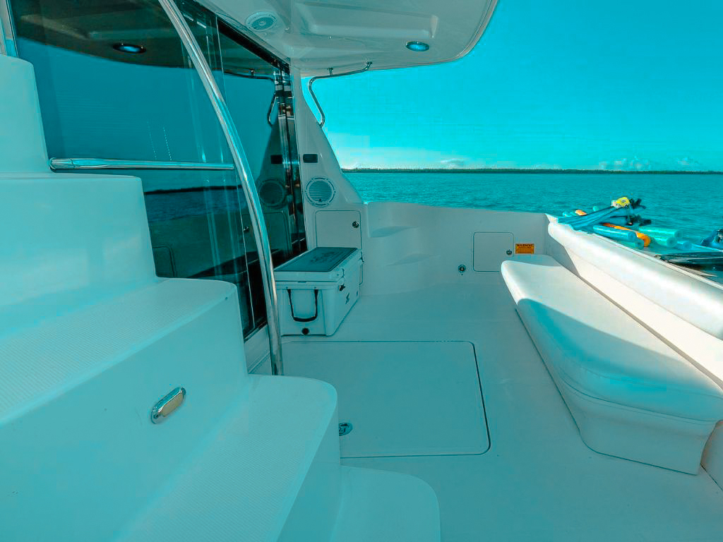 Aft deck of 56 Sea Ray yacht with seating and dining area
