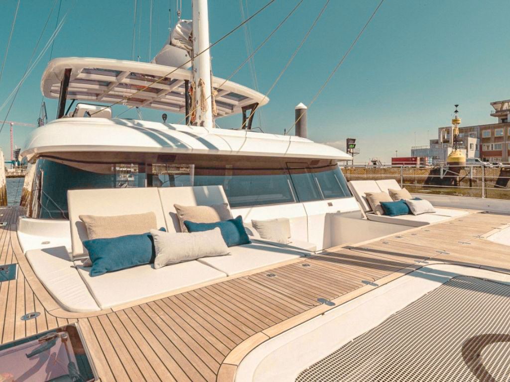 Guests enjoying water toys behind 60 Sunreef yacht