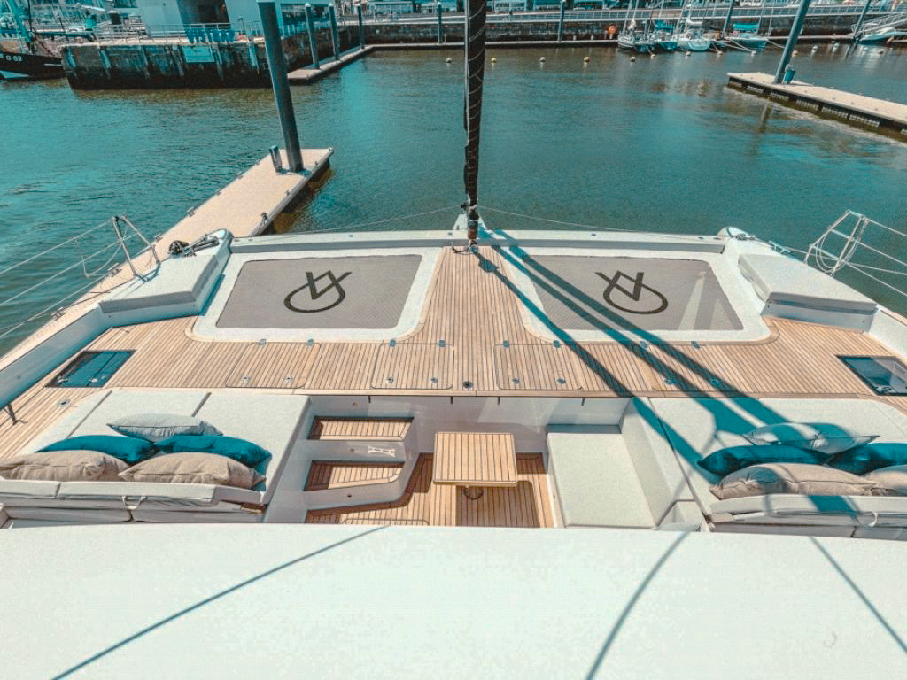 60 Sunreef yacht anchored in clear blue waters