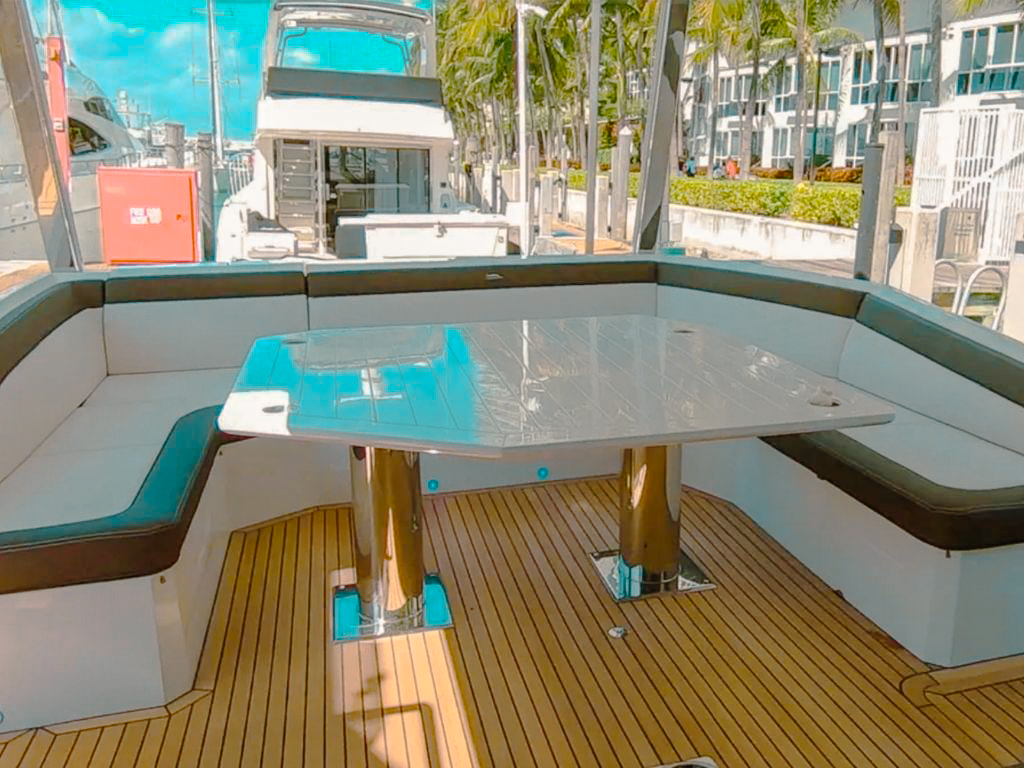 A woman on a jet ski next to the 68 Galeon yacht