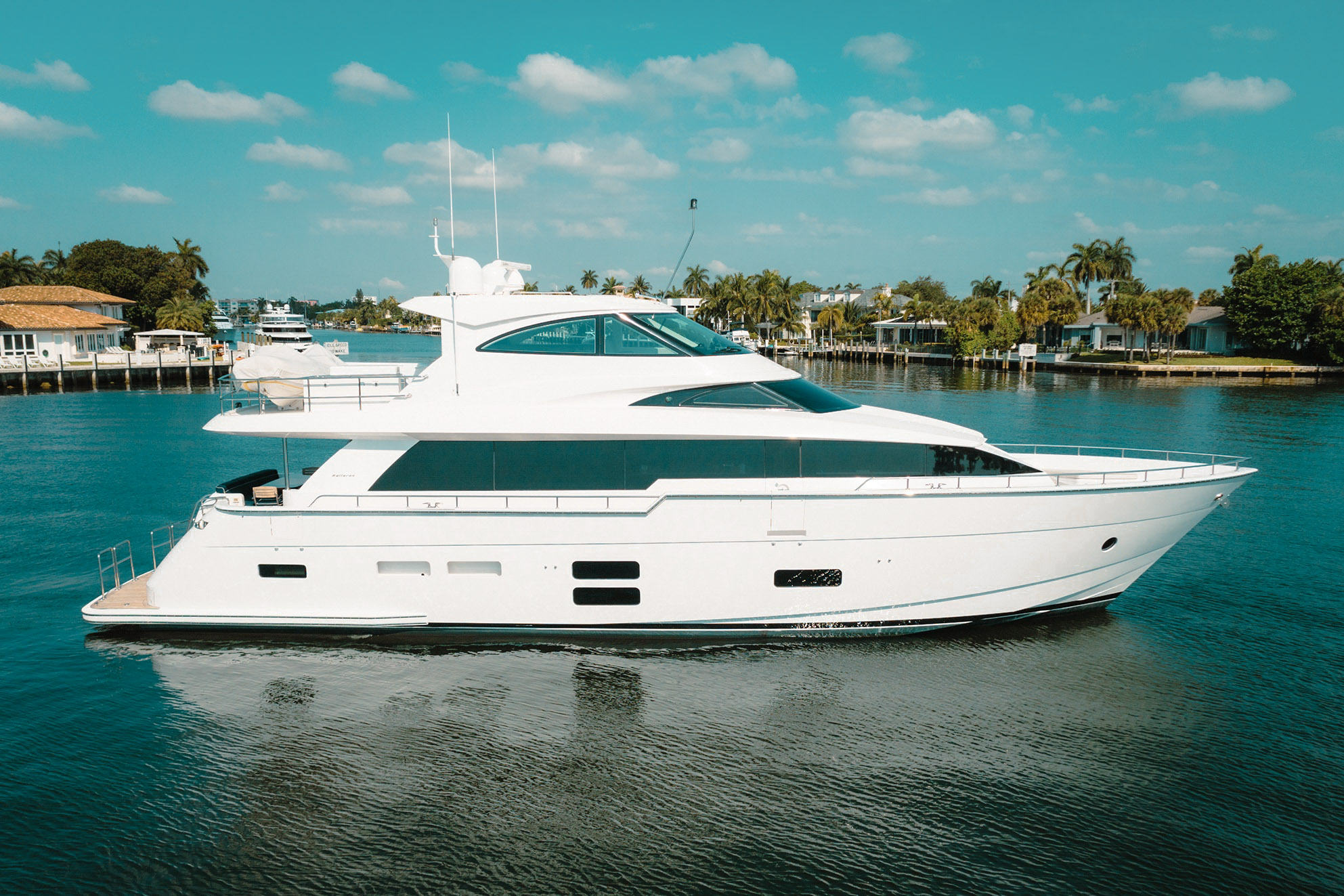 Side view of 75 Hatteras II yacht with clear waters
