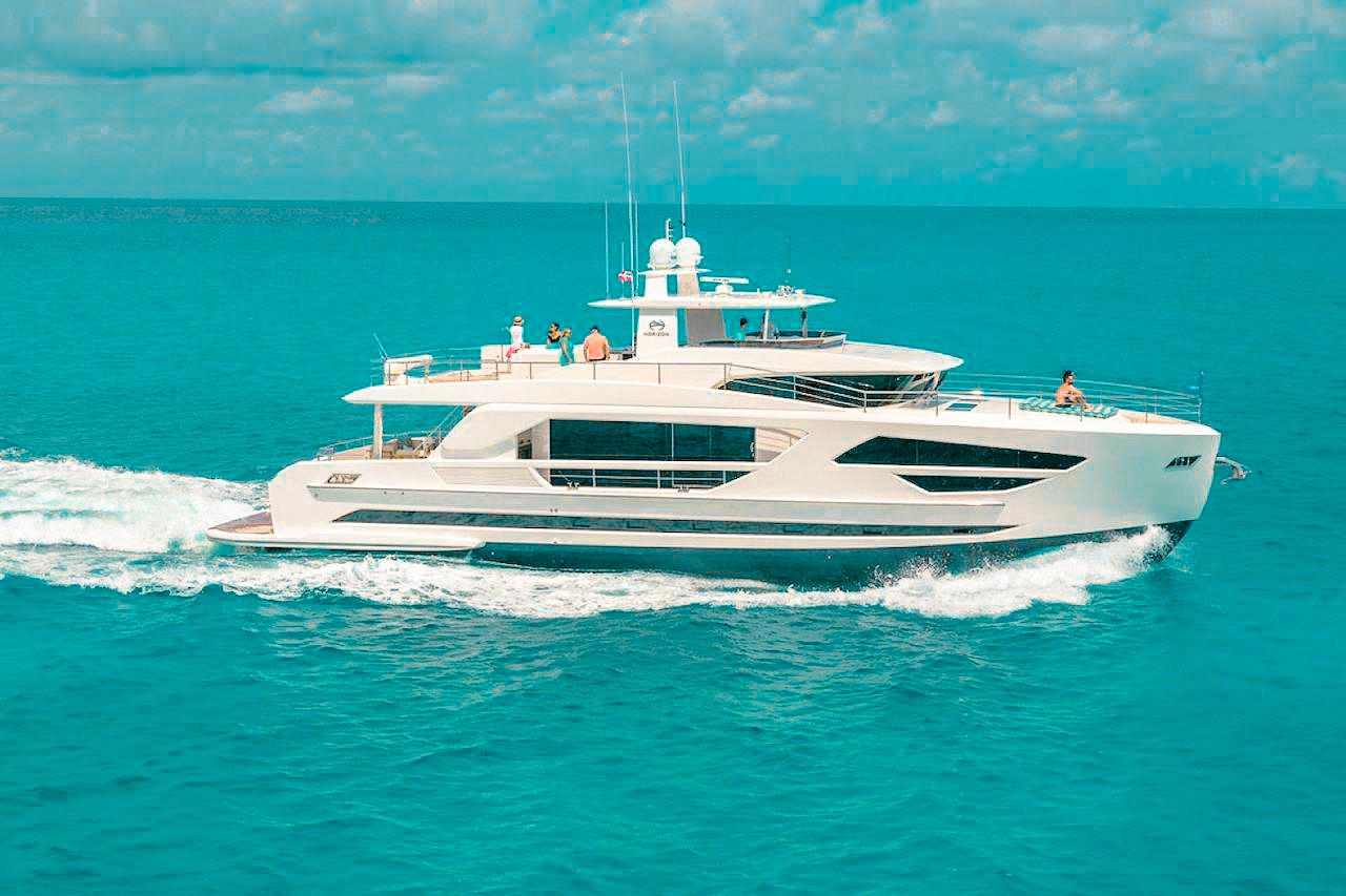 Exterior view of the 87 Horizon yacht cruising the Bahamas waters