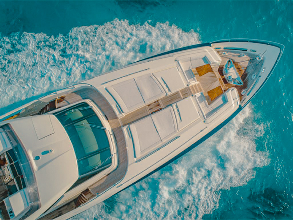 Front view of the 100 Ferretti yacht docked in a tropical marina