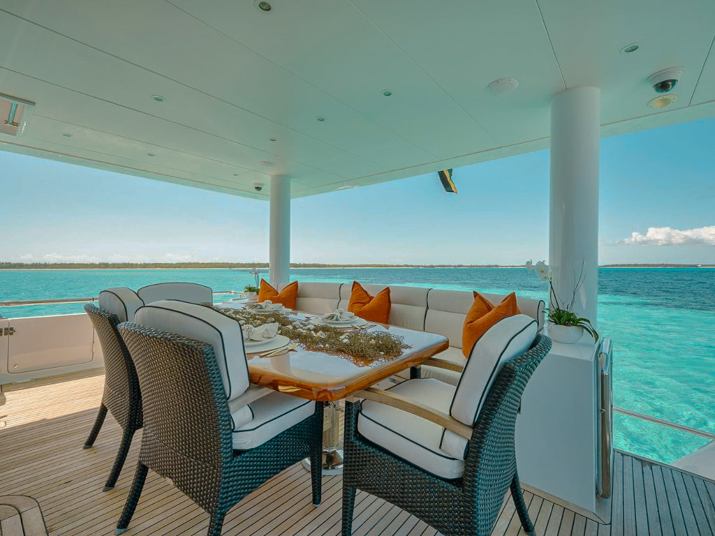 101 Hargrave yacht anchored off a beautiful beach in The Bahamas