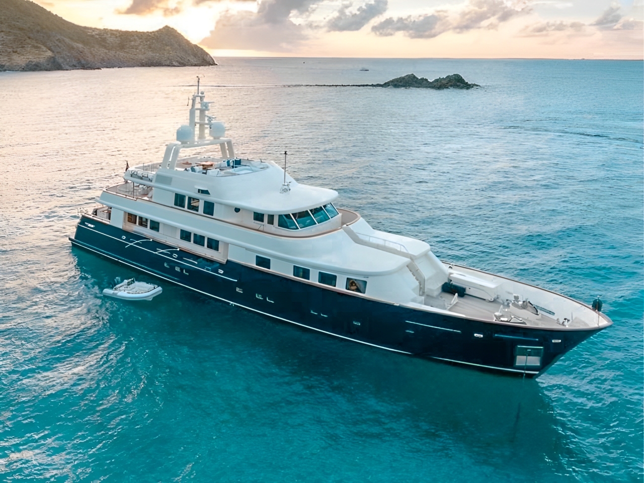 Side view of the 139 Holland yacht at anchor