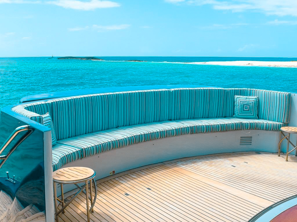 Heesen 143 yacht at anchor in clear Bahamian waters