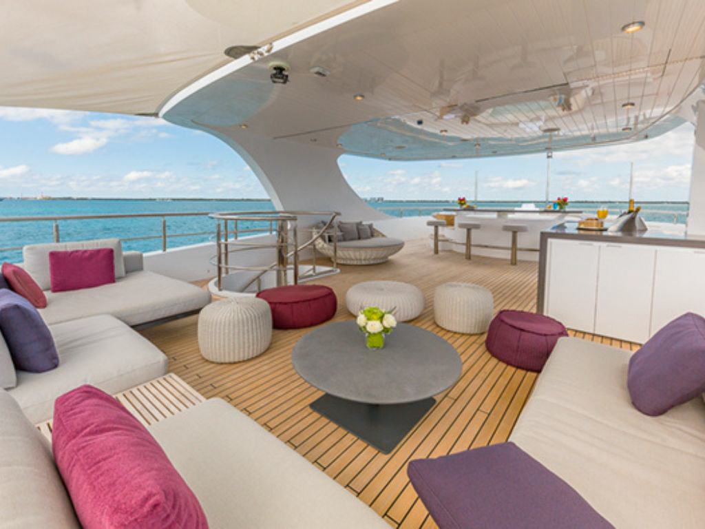 People enjoying the jacuzzi on the deck of the 157 Oceanfast yacht