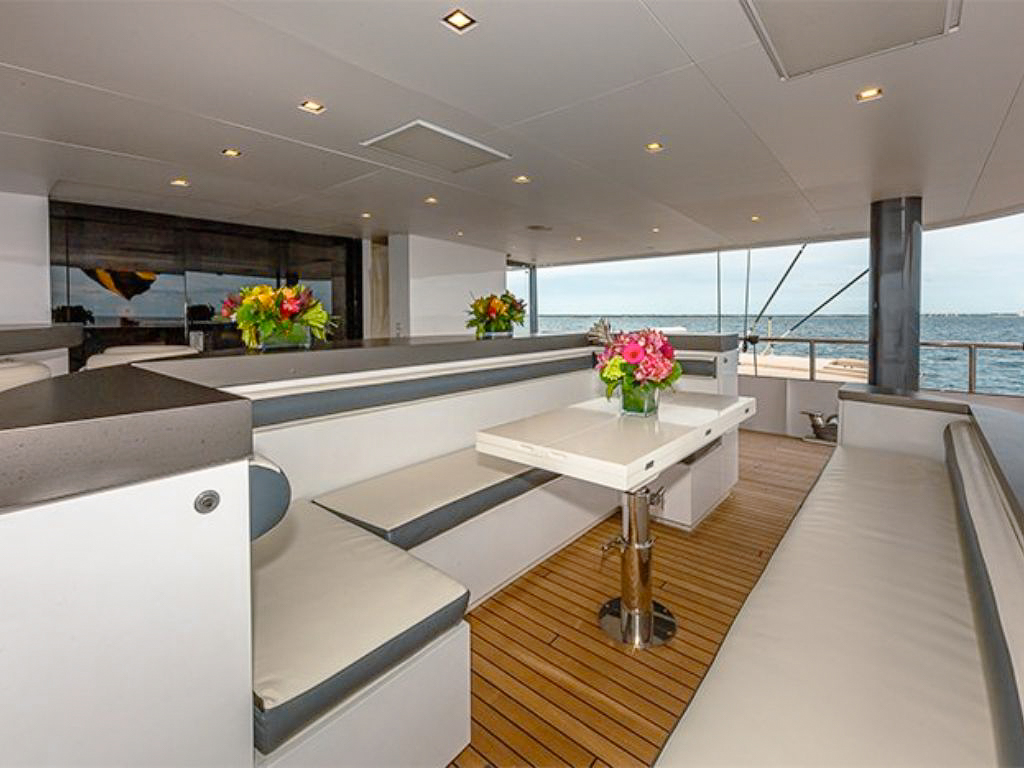 A smaller boat being launched from 162 Feadship yacht