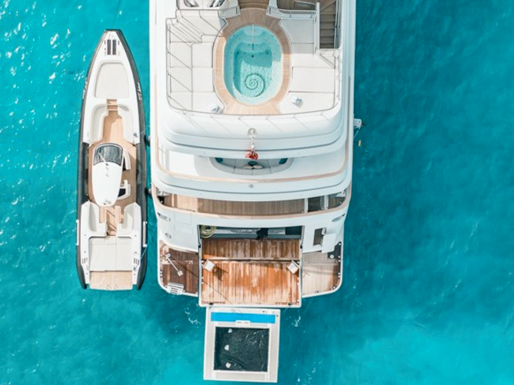 The 208 Benetti yacht anchored near a beautiful beach
