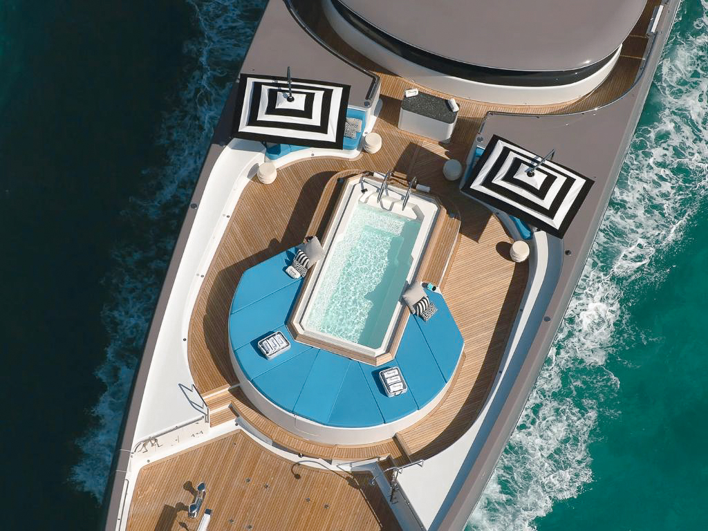 Guests enjoying water toys behind 238 Lurssen yacht