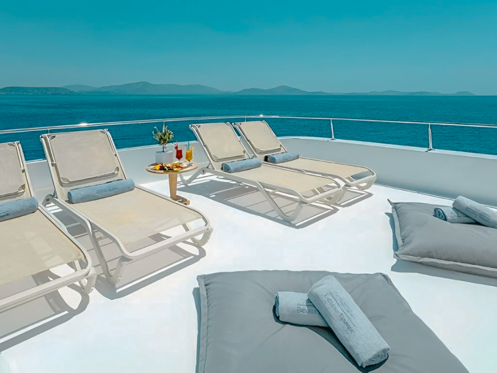 People enjoying activities on the back deck of 164 Delta yacht
