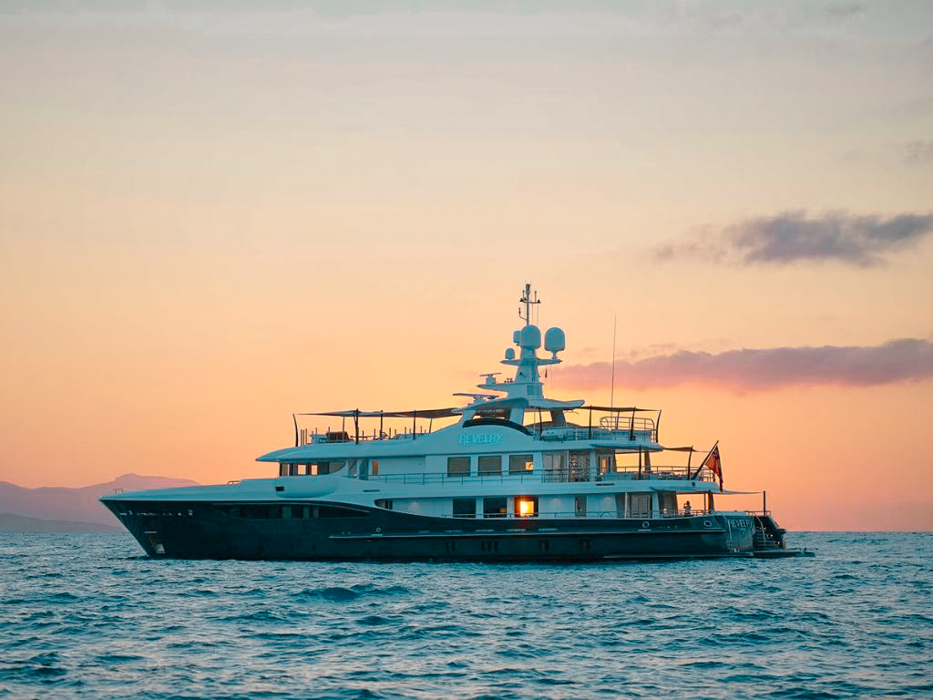 Top deck of 180 Amels yacht with sunbeds and ocean views