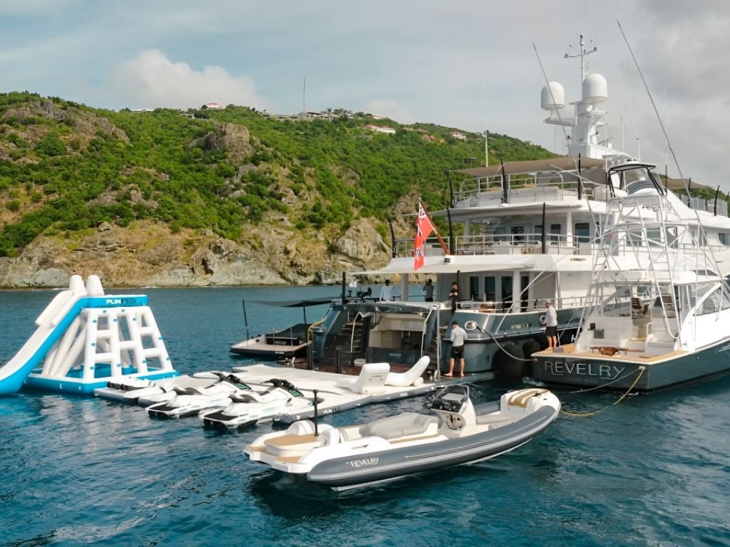 180 Amels yacht with a fun waterslide into the ocean