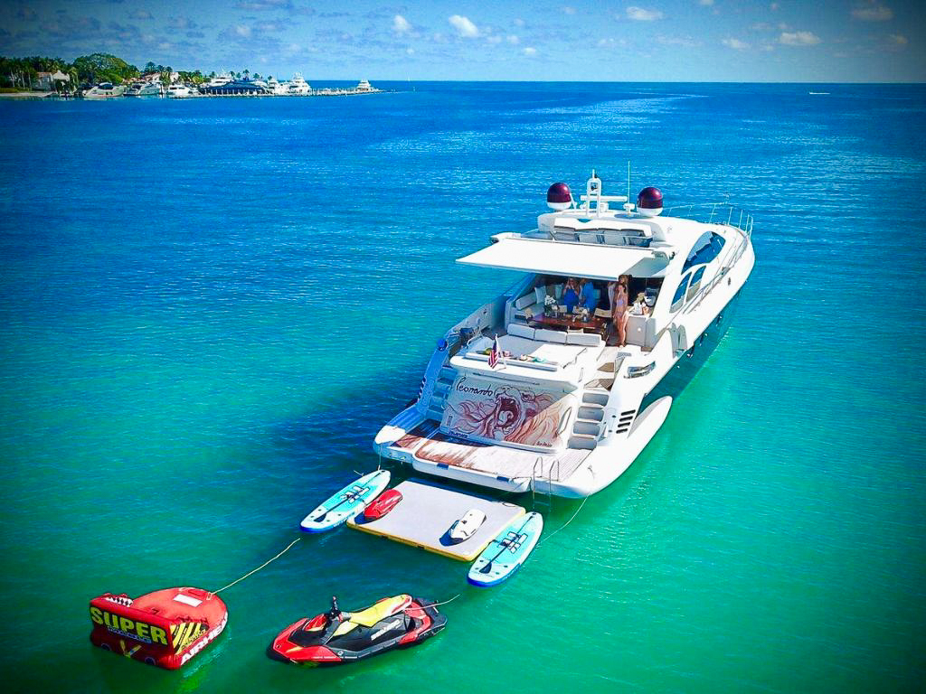 People relaxing on swim platform of 86 Azimut S yacht