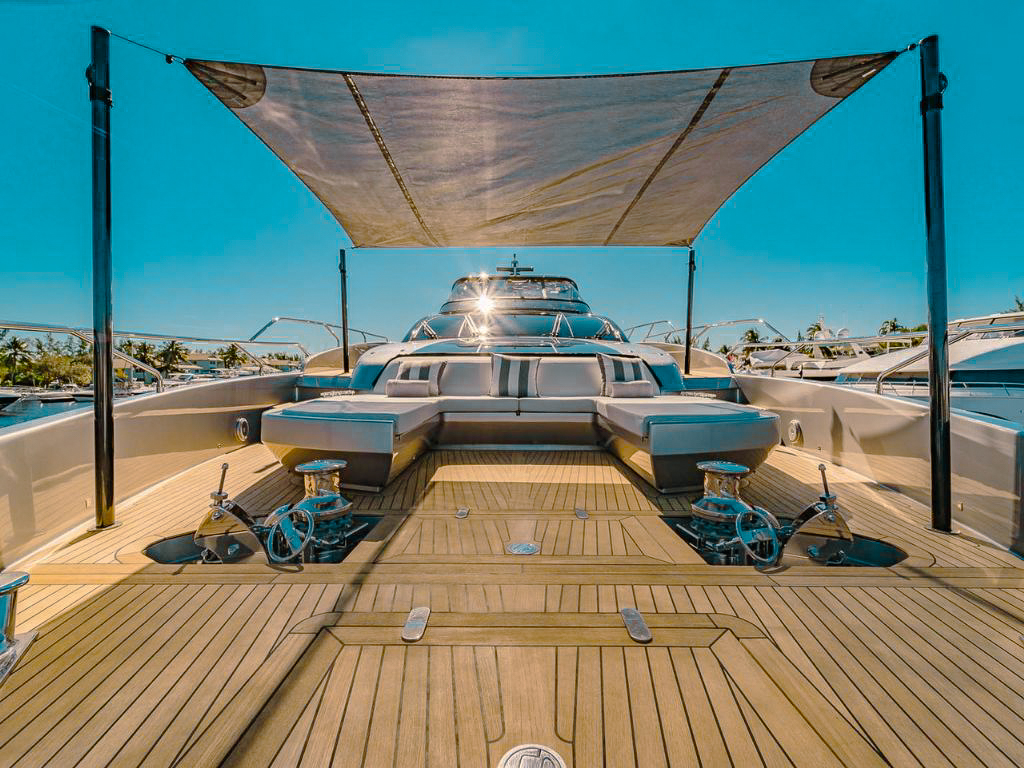 Bow of 94 Riva yacht with sunbeds overlooking the ocean