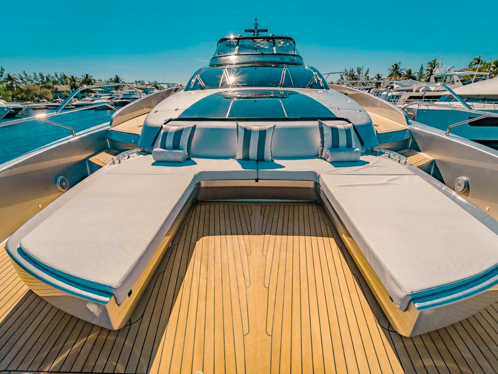 Flybridge of 94 Riva yacht with lounge chairs and seating